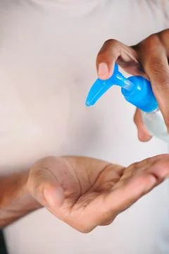 Hand sanitizing before an activity Stock Photos