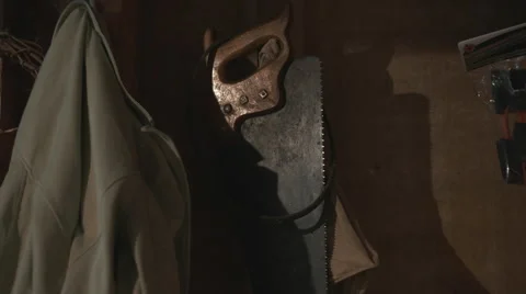 Hand Saw on a Wall Indoors. Stock Footage 58632053