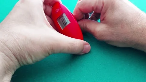 Hand Scale: Precision Grip and Weight Measurement Stock Footage 310933601