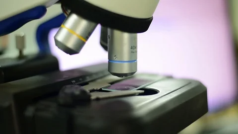 Hand scientist using microscope. Stock Footage 128103696