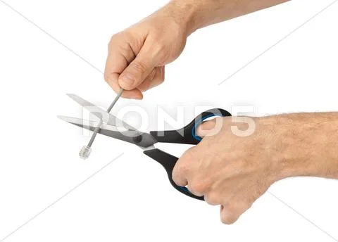 Hand with scissors and phone cable Stock Photos