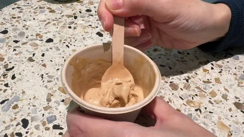 Hand Scooping Coffee Ice Cream in Paper Cup Close Up. 스톡 동영상 335774590