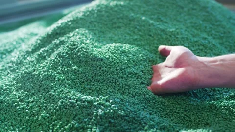 Hand Scooping Green Plastic Pellets, Recycling Facility Close Up Shot Stock Footage 342288496