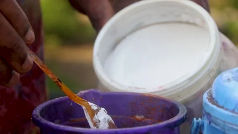 Hand scooping soda for batik tie and dye. Sodium hydroxide. Stock Footage 202435381