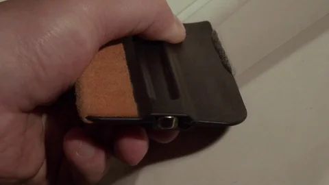 Hand scraper removes glue from the surface Stock Footage 127197579