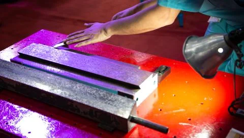 Hand scraping old bed machine Stock Photos