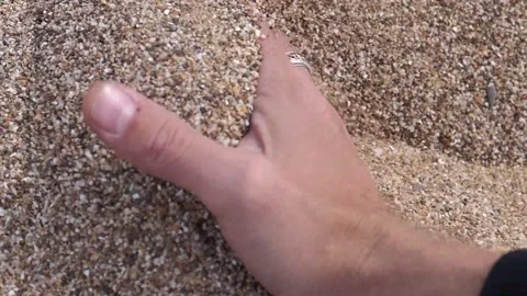 Hand scratches the sand Stock Footage 132361267