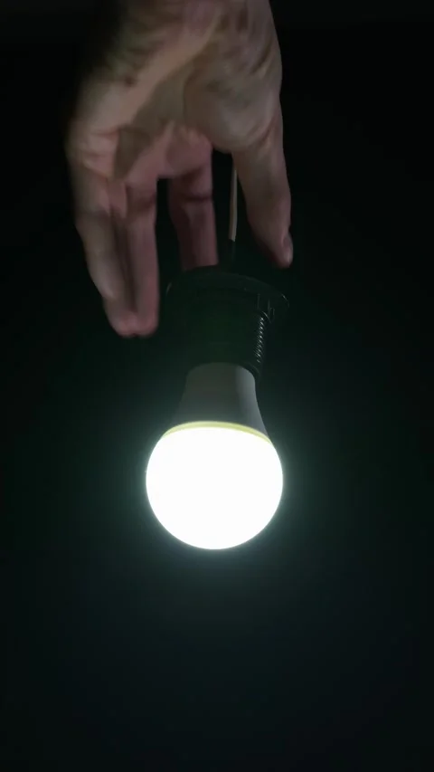 Hand Screwing Flickering Led Lightbulb Into Dark Socket During Power Outage Stock Footage 334136559