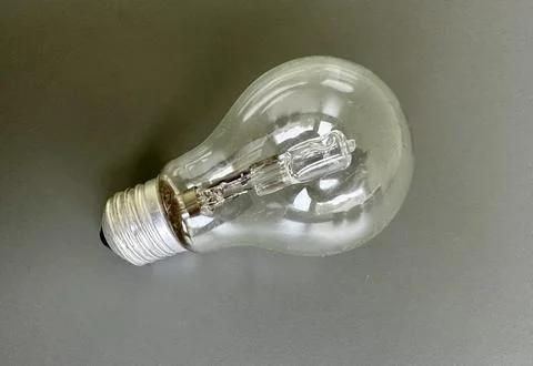 Hand Screwing Light Bulb into Socket Stock Photos