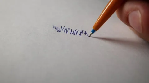 Hand Scribbling with Orange Ballpoint Pen on Blank White Paper Stock Footage 339365723