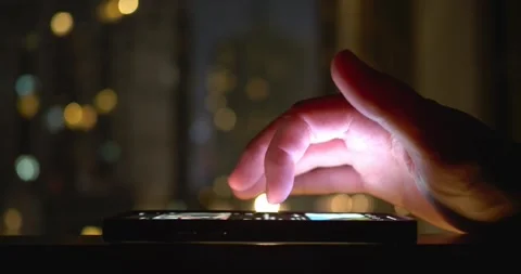 Hand scrolling smartphone dark, modern technology use. ubiquitous nature Stock Footage 259842174
