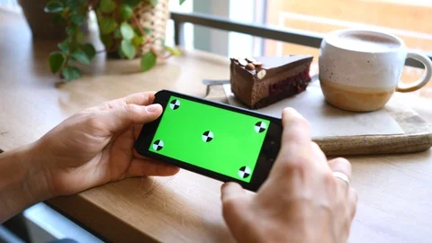 Hand Scrolling Smartphone Screen With Chroma Key On Display With Tracking Points Stockbeeldmateriaal 118765962