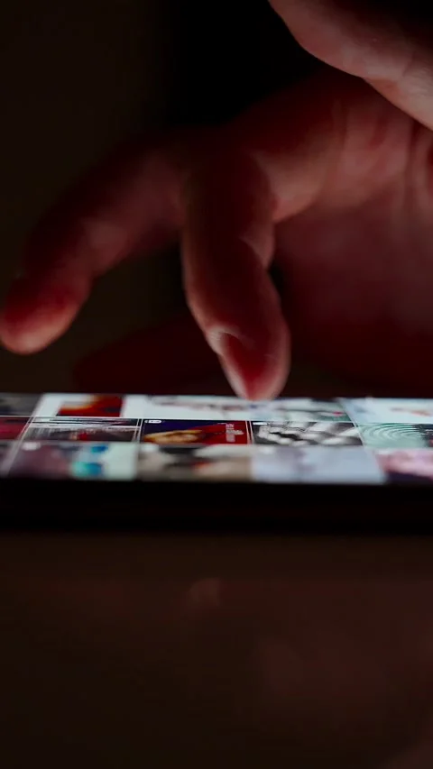 Hand scrolling on smartphone screen in dark environment Stock Footage 264981995