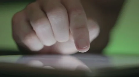 Hand that scrolls and zooms on a tablet Stock Footage 45313567