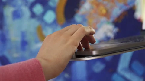 Hand scrolls a touchpad on a laptop while scrolling through the feed on Internet Stock Footage 171155263
