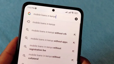 Hand Searching Mobile Loans in Kenya Online Stock Footage 308480404