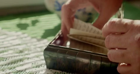 Hand Searching Through Antique Keepsake Box Filled with Vintage Memories Stock Footage 344348496