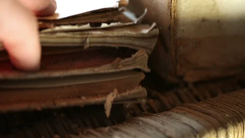 Hand searching through old dusty stored manuscripts Stock Footage 95565186