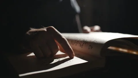 Hand searching through old dusty stored manuscripts Stock-Footage 99080681