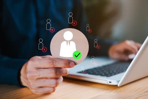 Hand selecting a candidate with green checkmark icon among rejected applica.. Stock Photos