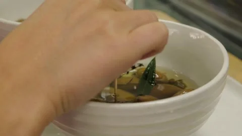 Hand Selecting Marinated Olives from Bowl at Sydney Market Food Counter Stock Footage 345711366