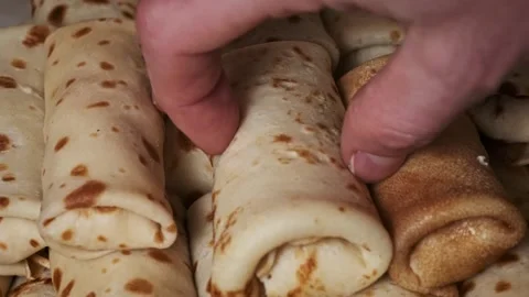 Hand Selecting a Pancake from a Freshly Made Stack Stock Footage 298679672