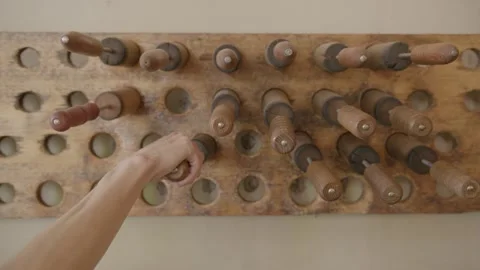 Hand Selecting Wooden Rolling Pin from Wall Rack in Sydney Bakery Interior Stock Footage 345657704