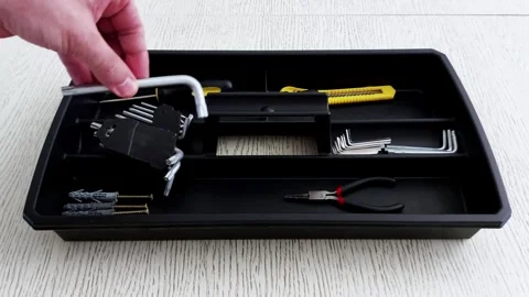 Hand Selects Allen Key from Neatly Arranged Black Tool Tray Stock Footage 314491832