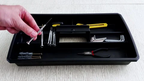 Hand Selects Tools from Black Tray: Precision and Practical Order Stock Footage 314491800