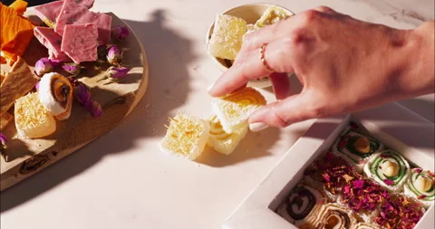 Hand Selects Turkish Delight Near Gift Box and Treat Board Vídeo Stock 308917633