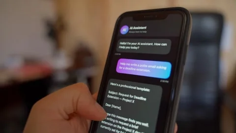 Hand sending message to AI chatbot assistant on smartphone close-up Stock Footage 340388986