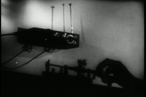 Hand sending morse code message through shortwave transmitter Stock Footage 11348764