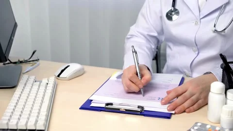 Hand of senior doctor taking notes in office Low angle view of male medical Stock-Footage 336588295