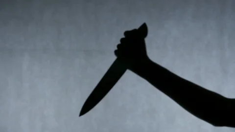 Hand of serial killer stabbing victim multiple times with a knife, crime scene Stock Footage 87670802