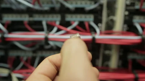 Hand in the server sticks plug into a network Stock Footage 44405602