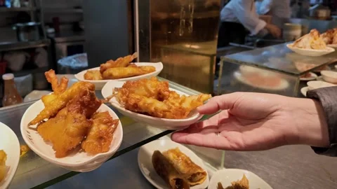 Hand Serves Fried Seafood in Kitchen Stock Footage 259249382
