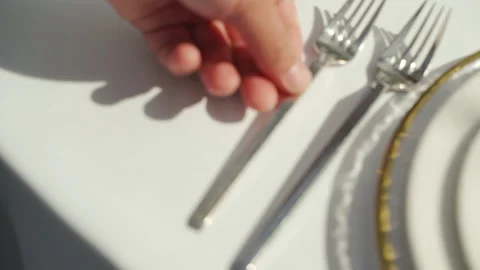 A hand serves a wedding table with fork Stock Footage 150118643