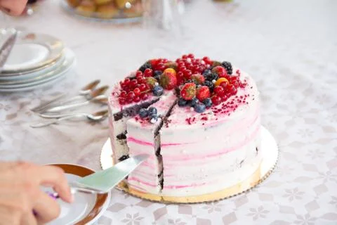 Hand serving birthday cake Stock Photos