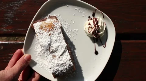 Hand serving a cake strudel Stock Footage 47210885