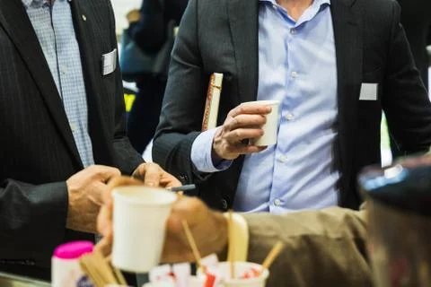 Hand serving a cup of coffee Stock Photos