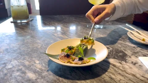 Hand Serving Fancy Tapas with Fork at Outdoor Table Stock Footage 311931085