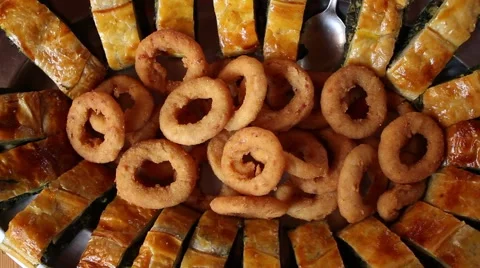 Hand serving a fried fish spinach cake Stock-Footage 47210951