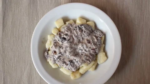 Hand serving gnocchi Stock Footage 47211152
