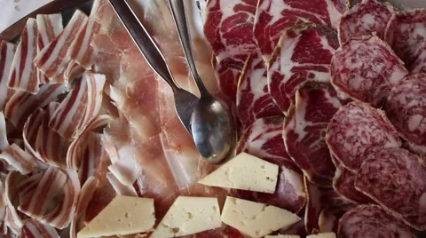 Hand serving a mixed salami dish Stock-Footage 47210982