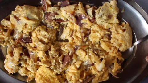 Hand serving scrambled eggs with bacon Stock Footage 47211093