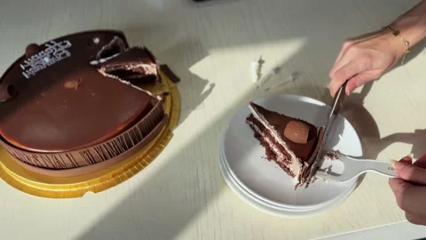 Hand Serving Slice Of Chocolate Birthday Cake Stock Footage 343385958