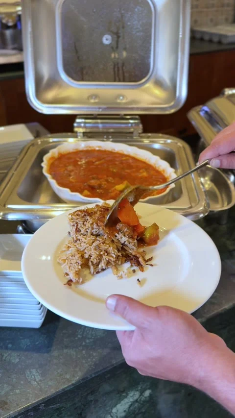 Hand Serving Stew And Rice At Catering Buffet Stock Footage 344549777