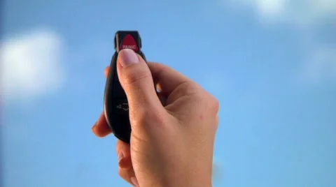 Hand sets car alarm Stock Footage 197977