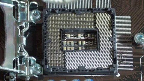 Hand sets Silver Bitcoin virtual currency on a motherboard instead cpu Stock Footage
