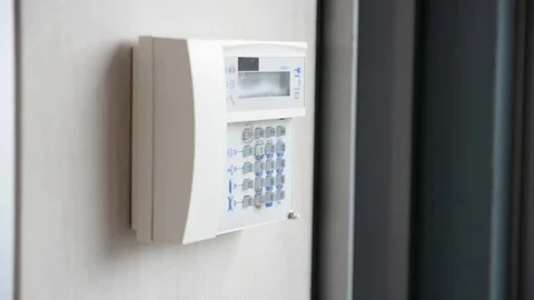 Hand setting anti-theft alarm device Stock Footage 75571908